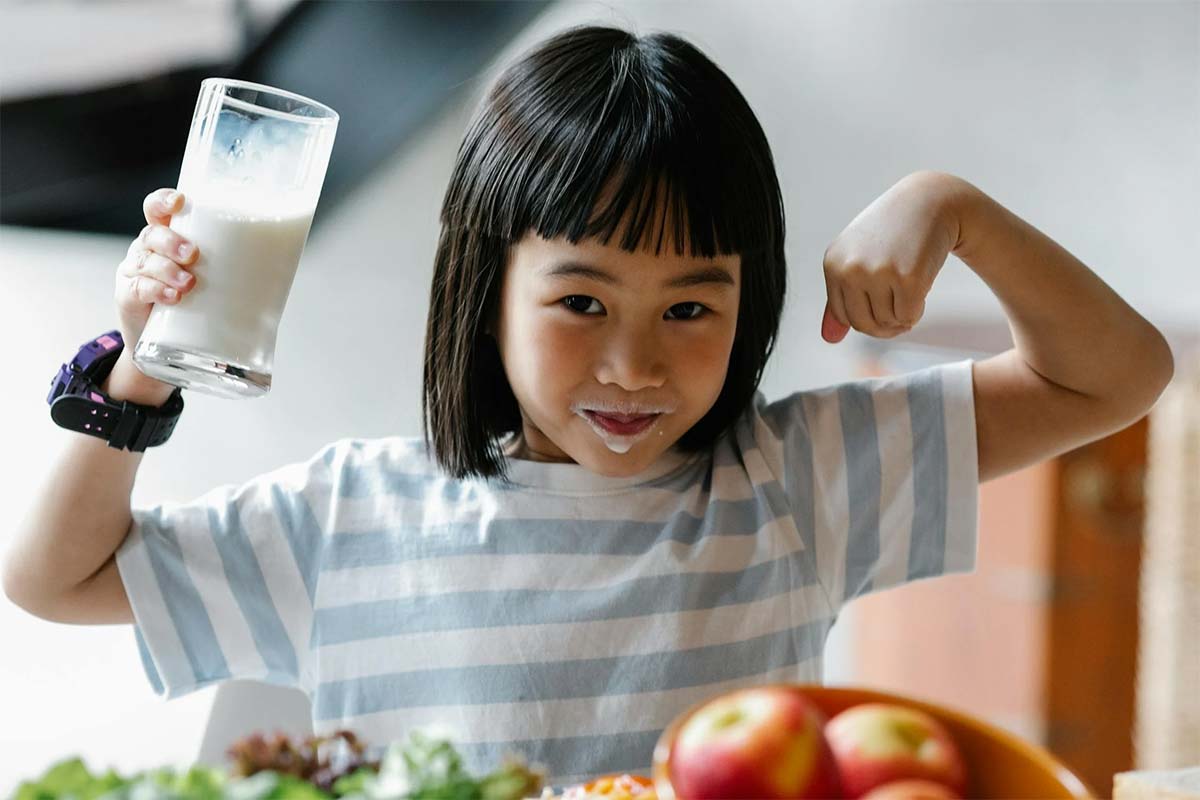 A healthy child making muscles
